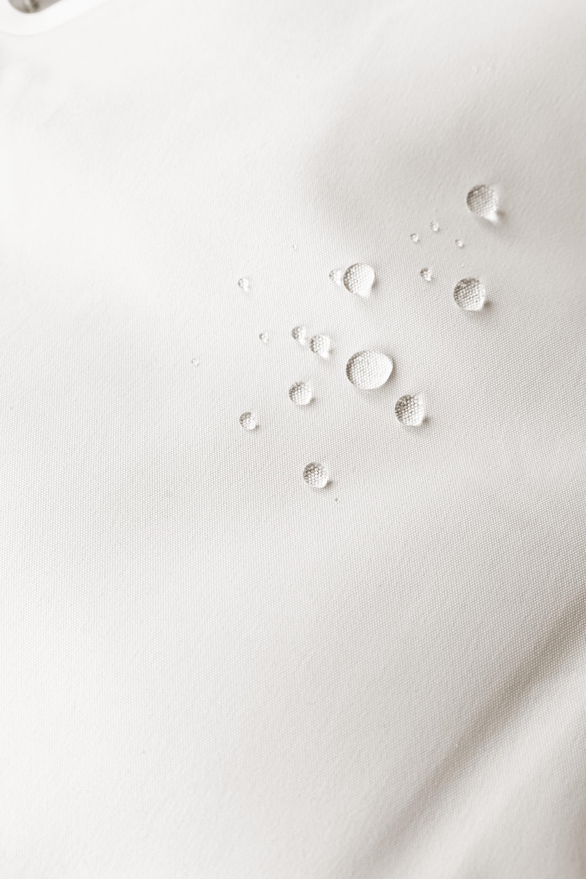 WATER RESISTANT AND WINDPROOF RECCO® SYSTEM SKI COLLECTION LONG JUMPSUIT WITH FAUX FUR HOODIE